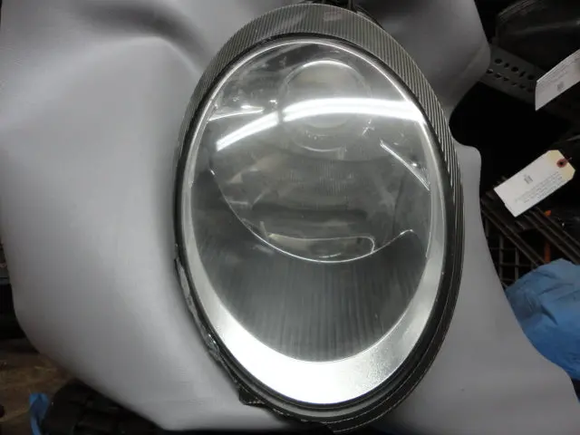 997 Headlight Left Driver Has Broken Edge Trim And Back Housing Is Cracked 1