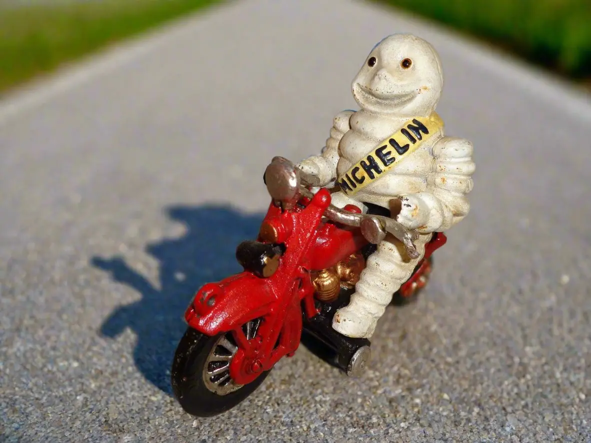 Michelin  Figurine - Cast Iron Michelin Man Vintage Toy W/ Motorcycle 1
