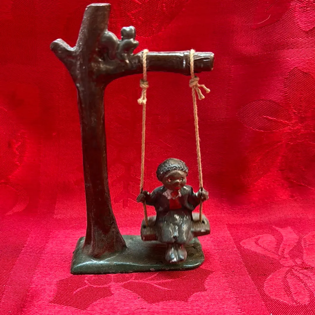 Lead Black Americana Boy Swinging 1