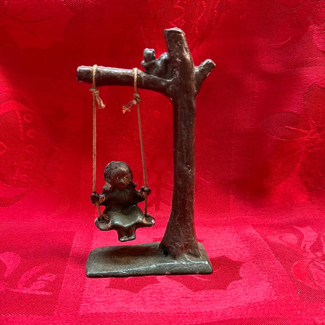 Lead Black Americana Girl Swinging 1