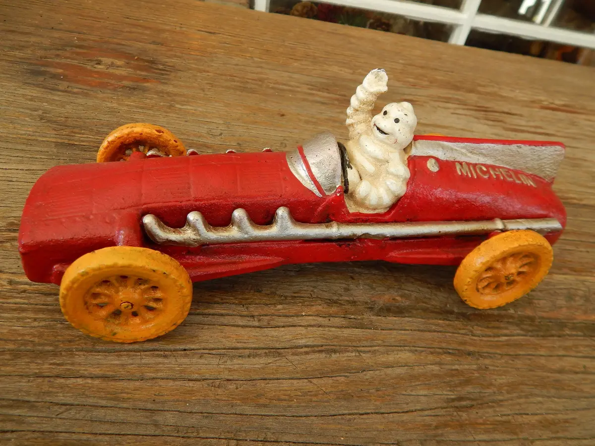 Michelin Figurine - Cast Iron Michelin Tire Advertising Red Race Car Toy 1