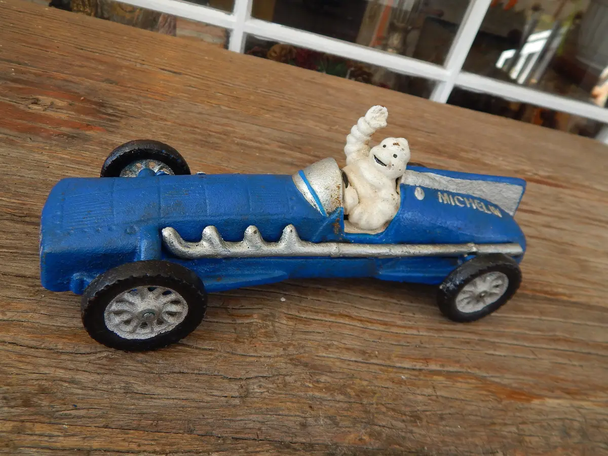 Michelin Figurine -Cast Iron  Michelin Tire Advertising Blue Race Car Toy 1