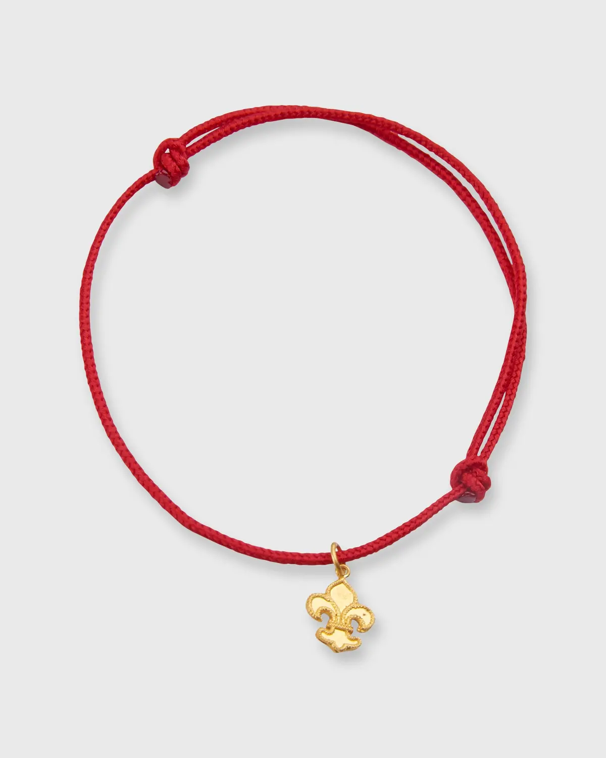 Fleur De Lys Charm Bracelet In Gold/Red Cord 1