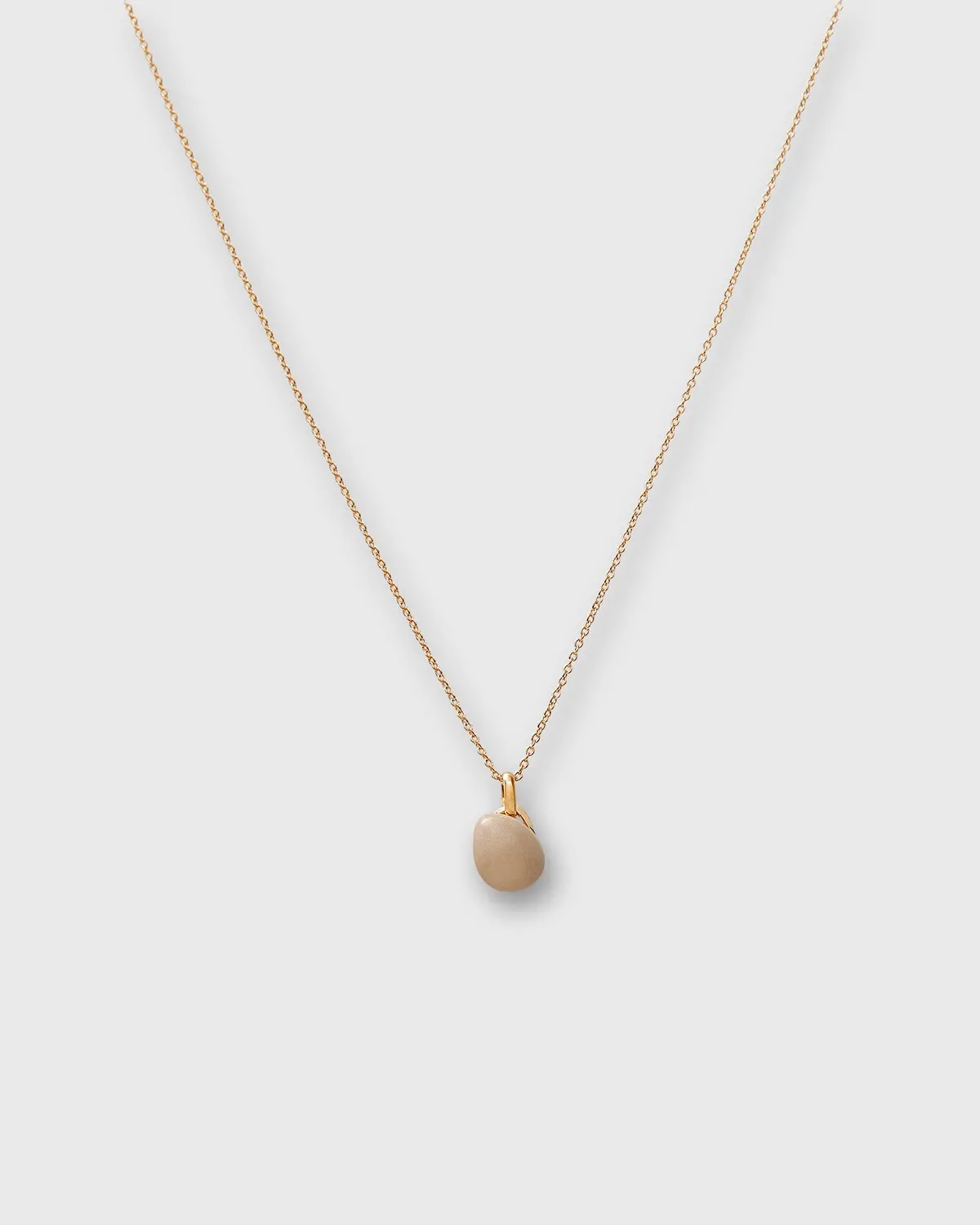 Tiny Ceramic Egg Pendant Necklace In Cream/Gold 1